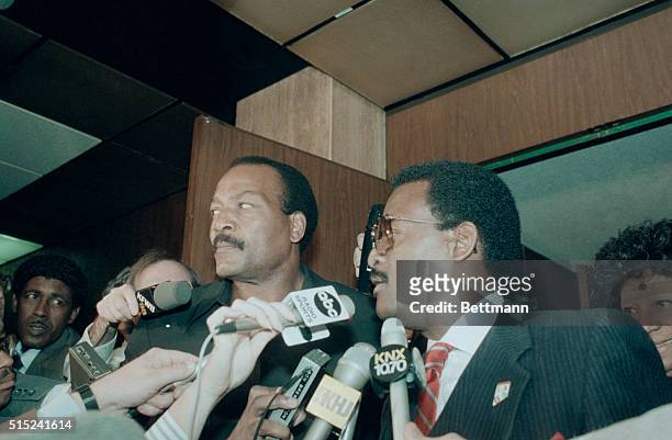 Former football star Jim Brown and his attorney Johnnie Cochran enter court in L.A. For Brown's arraignment on three counts of rape and sexual...