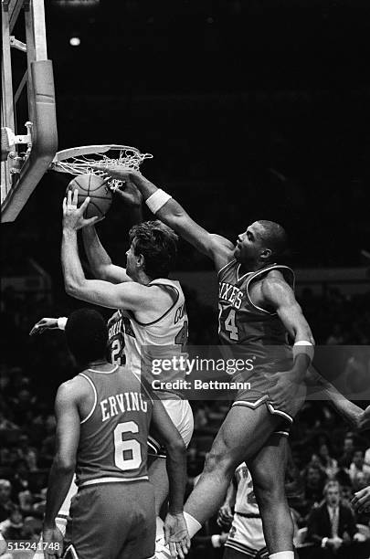 Philadelphia's Charles Barkley blocks the shot by New York Knicks' Pat Cummings in the first quarter of their game in Madison Square Garden. The...