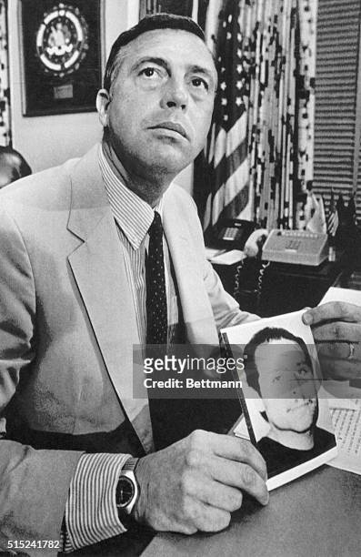 Agent James W. Greenleaf, Special Agent in charge of the Boston Field Office, holds a picture of Victor Manuel Gerena, one of the FBI's ten most...
