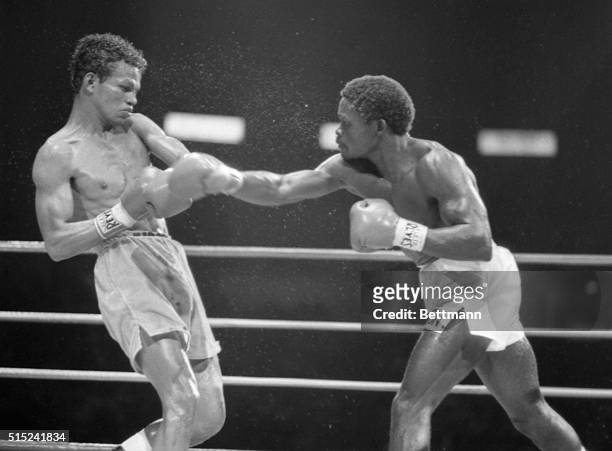 Marcus Villasana of Mexico backs away from a right thrown by Azumah Nelson of Ghana during WBC featherweight title match at the Forum. Nelson went on...