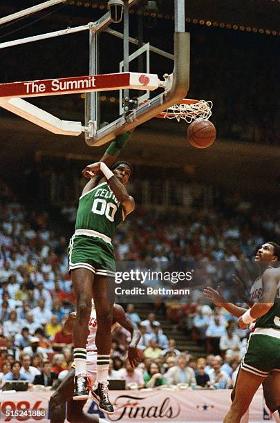 Boston Celtics Robert Parish slam dunks the ball during the 4th game of the NBA Finals 6/3 with the Houston Rockets.