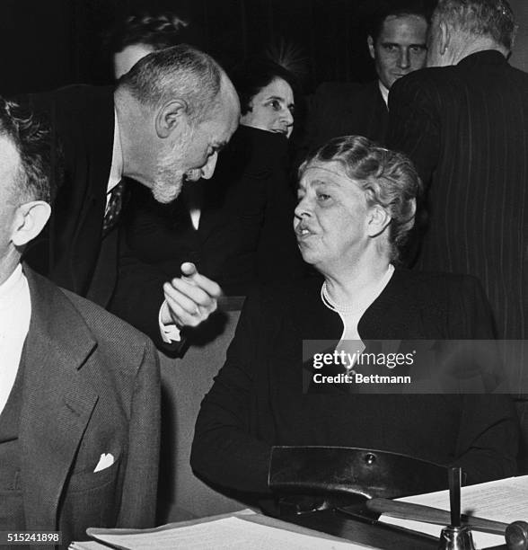 Geneva, Switzerland: Mrs. Franklin D. Roosevelt , chats with Rene Cassin, French delegate, during a session of the United Nations Human Rights...