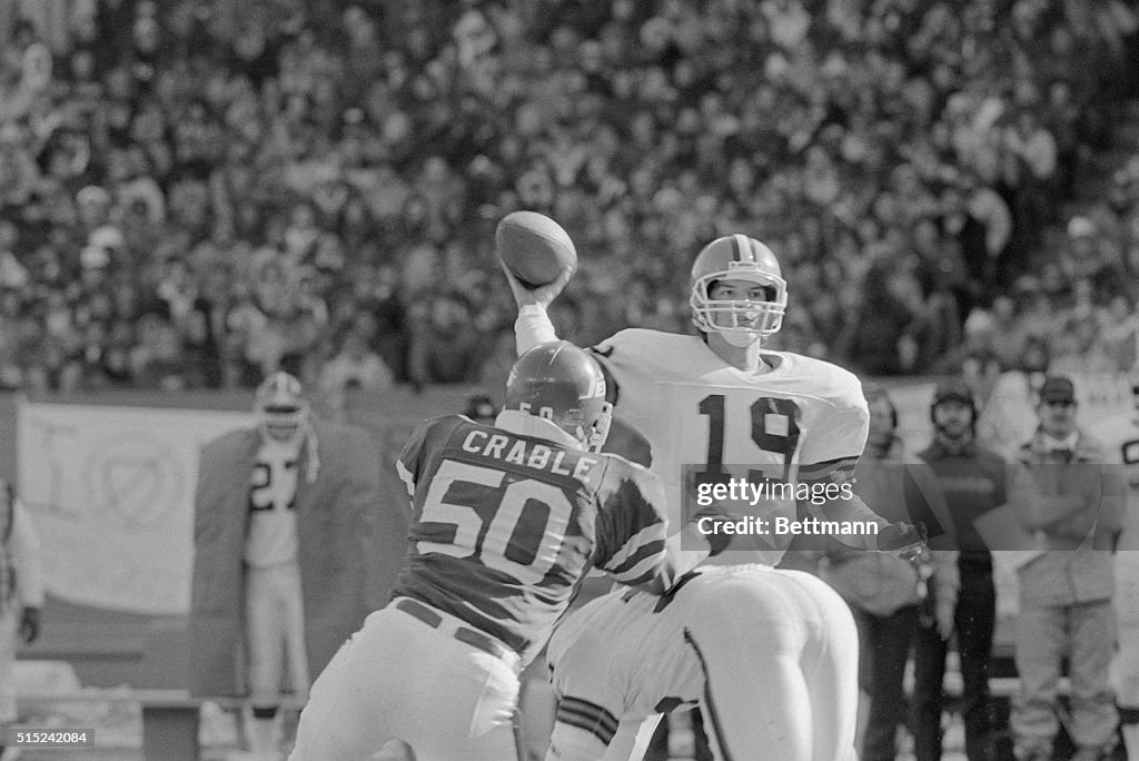 Bernie Kosar with Bob Crable During Football Game