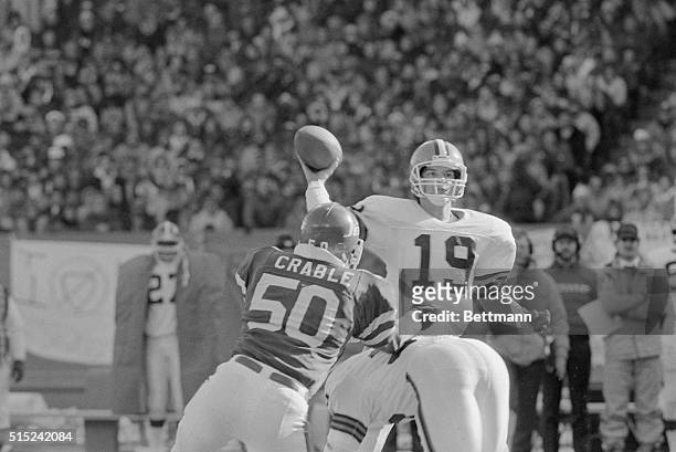 American Football Conference. Cleveland, Ohio: Browns Bernie Kosar throws pass in the 1st quarter under pressure for a short gain as Jets Bob Crable,...