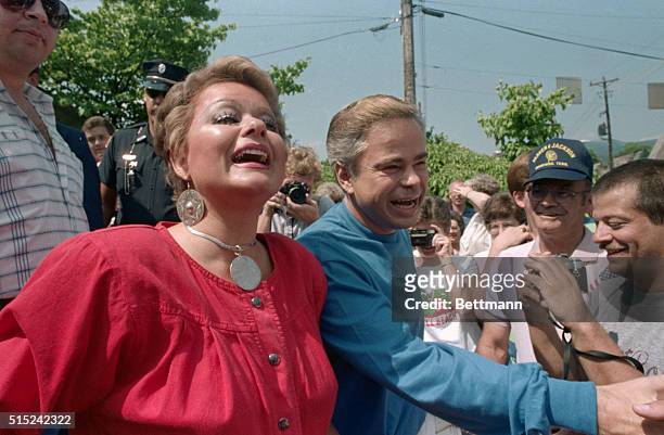 Gatlinburg, Tenn: PTL founder Jim Bakker and his wife Tammy Faye are greeted by wellwishers after they attended a scroll signing June 30 to...