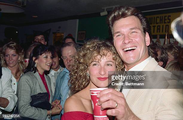 Hollywood: Actress Jennifer Grey gives a wink and a wave to cameras as she and her co-star Patrick Swayze attend a party following the showing of...