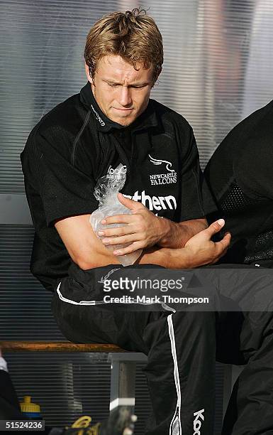 Jonny Wilkinson of Newcastle sits on the bench during the second half with an ice pack on his arm during the pre-season friendly match between...