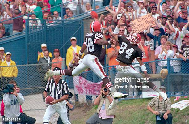 Cleveland, Ohio: Cleveland wide receiver Webster Slaughter receives a high-five from teammate Reggie Langhorne, after catching a Bernie Kosar pass...