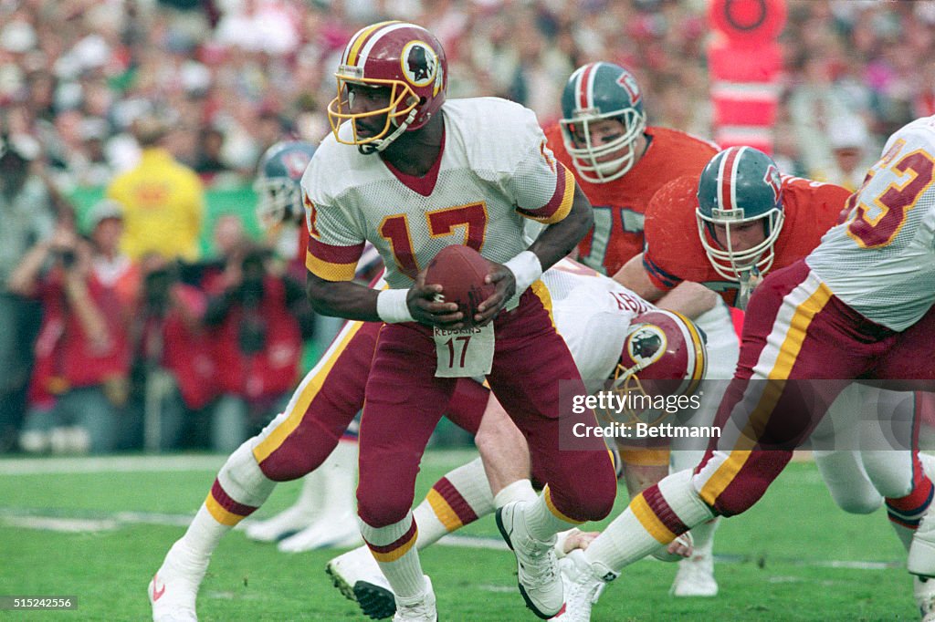 Doug Williams Holding Football