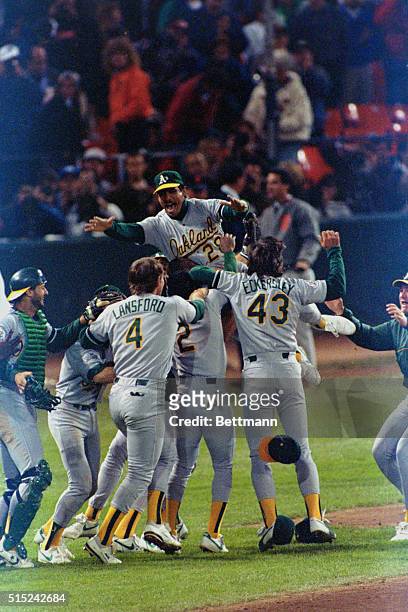 San Francisco: Stan Javier piles onto celebrating Oakland A's after they beat the Giants 9-6 to win the 1989 World Series.