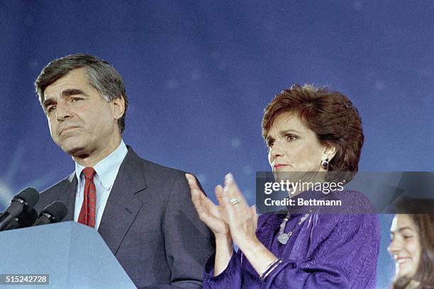 Boston: Democratic presidential candidate Michael Dukakis is applauded by his wife Kitty as he concedes the election to Vice President George Bush at...