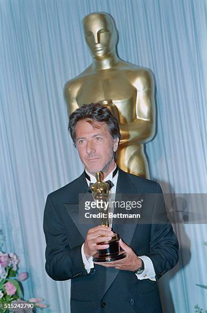 Actor Dustin Hoffman, receiving a Best Actor Academy Award for his performance in the 1988 film Rain Man.