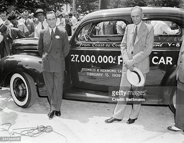 Three Fords -- Henry, Edsel, and 27 000th -- at the Fair. New York, New York: Motor mogul Henry Ford and his son Edsel, proudly pose with the 27...