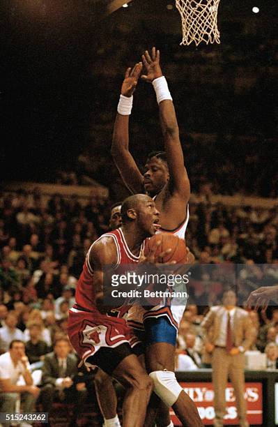 Patrick Ewing of the New York Knicks plays Michael Jordan close as the Bulls' superstar drives for the basket during their NBA playoff game 5/11. The...