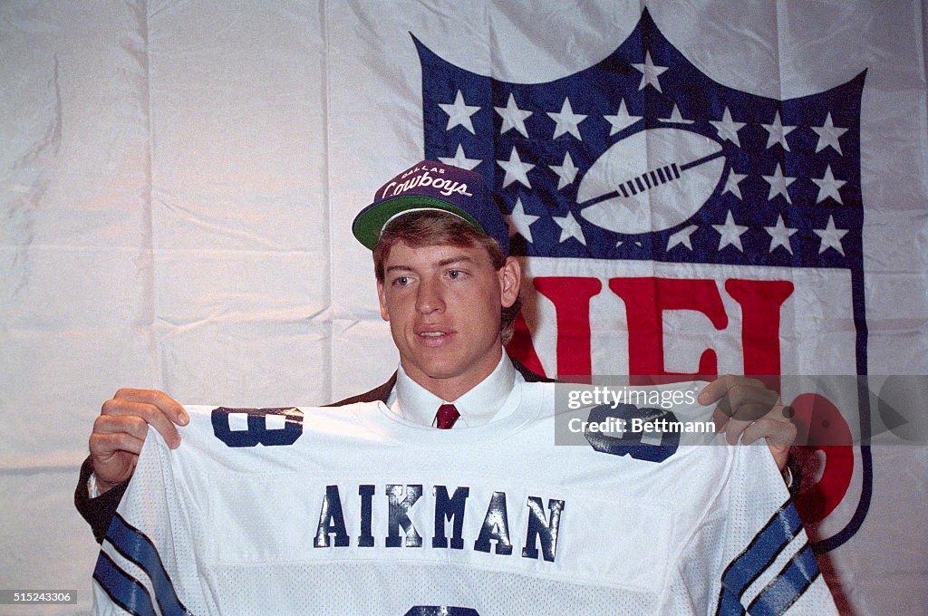 Troy Aikman Holding Jersey