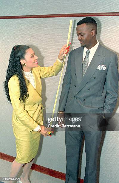 Indianapolis: Florence Griffith Joyner takes the measure of George McCloud, the Indiana Pacers' draft pick, following the announcement that Flojo...