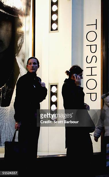 People walk past a Topshop store which is part of the Arcadia Group, on October 21, 2004 in London, England. Entrepreneur and owner of retail group...