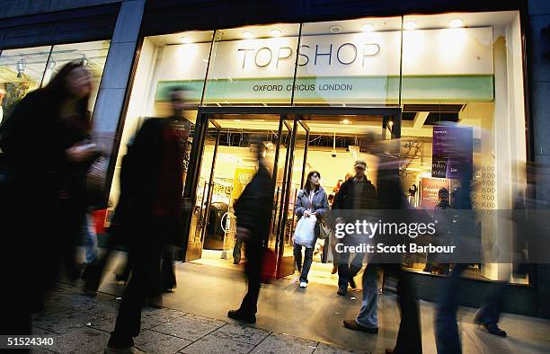 People walk past a Topshop store which is part of the Arcadia Group, on October 21, 2004 in London, England. Entrepreneur and owner of retail group...