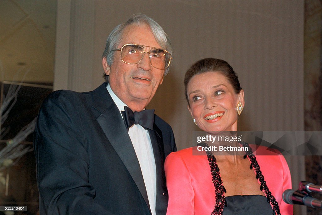 Audrey Hepburn and Gregory Peck Attending Award Ceremony