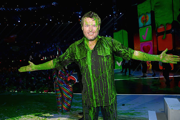 Host Blake Shelton gets slimed onstage during Nickelodeon's 2016 Kids' Choice Awards at The Forum on March 12, 2016 in Inglewood, California.