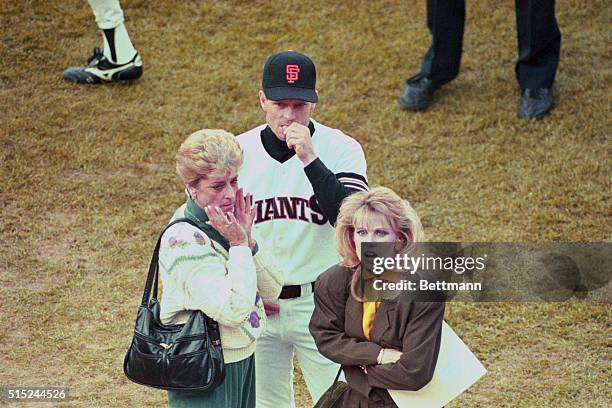 San Francisco: Giants' Brett Butler leads his family off the Candlestick Park after an earthquake cancelled game 3 of the World Series.