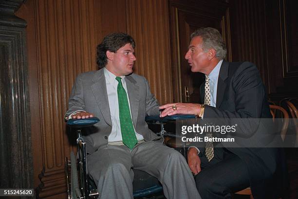Washington: Marc Buoniconti , the quadriplegic son of former all-pro linebacker Nick Buoniconti , speaks with his father after receiving the American...