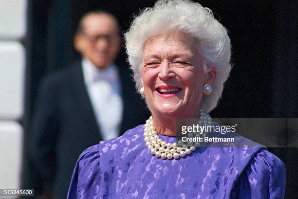 Washington: First Lady Barbara Bush appears outside the White House awaiting the arrival of Queen Silvia of Sweden. Mrs. Bush was treated for a...
