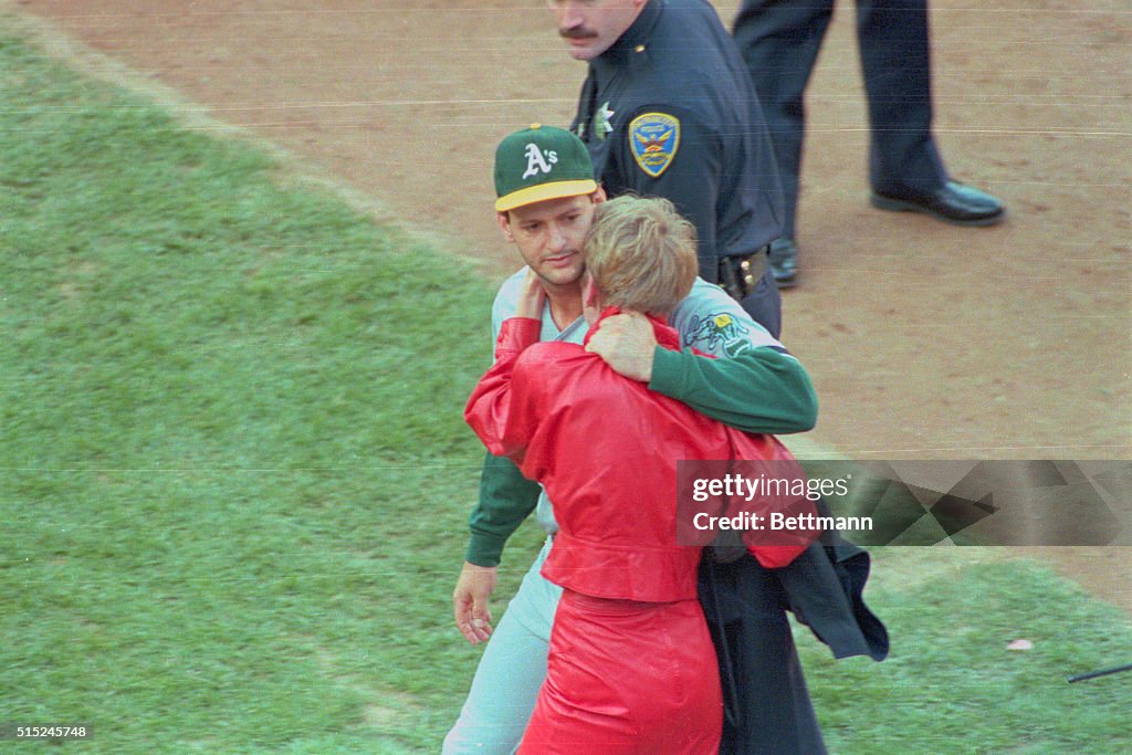 Terry Steinbach Embracing His Wife on Field