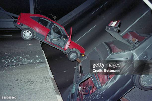 San Francisco; Two cars are trapped on the collapsed section of the Bay Bridge following earthquake.