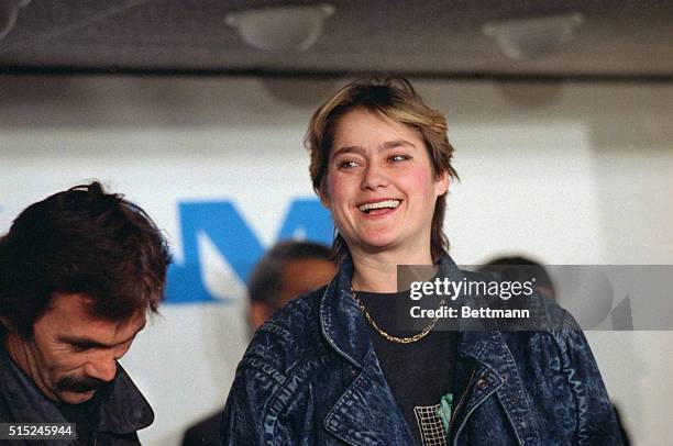 Romanian Olympic gold medalist Nadia Comaneci speaks with reporters upon her arrival to John F. Kennedy International Airport. The gymnast, who...