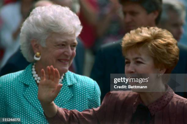 Washington: First lady Barbara Bush looks at Raisa Gorbachev as she waves to the press prior to their departure To Camp David, Md. For the third day...