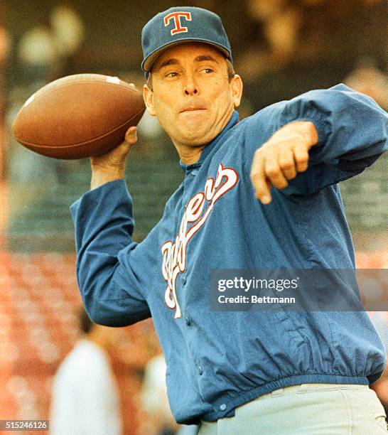 Milwaukee: Texas Rangers' pitcher Nolan Ryan tosses a football during pregame warm-ups 7/31, the night he will attempt to become the 20th pitcher in...