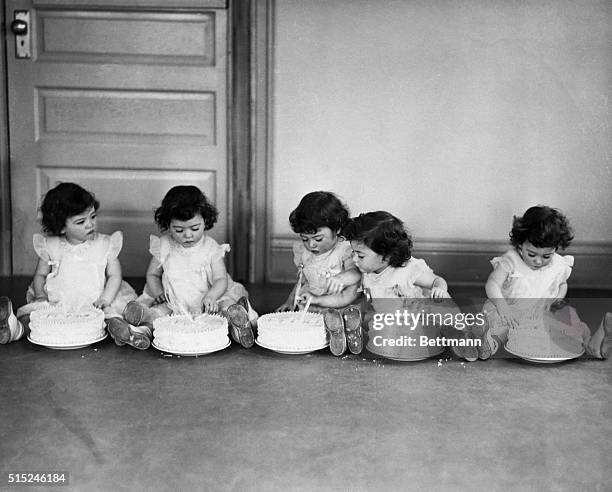 Callender, Ontario- On their second birthday, the quints each had a big cake to dig into. Left to right: Yvonne, Annette, Cecile, Emilie and Marie....