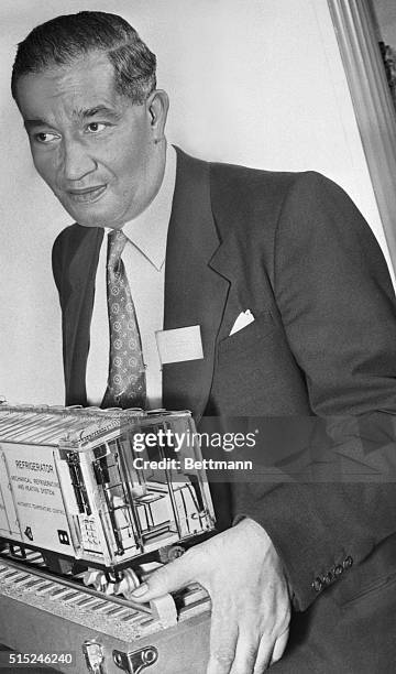 Portrait of American inventor Frederick McKinley Jones , as he poses with model of a refrigerated railroad car inventor, 1951. His designed for...