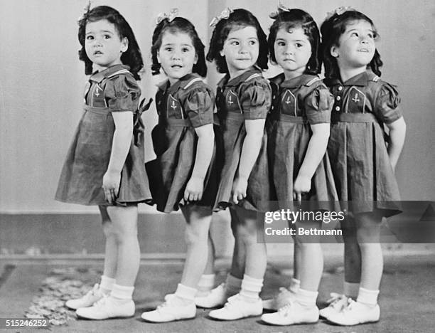 The world-famed Dionne Quintuplets are presently enjoying their first visit to New York, where they are guests of Francis Cardinal Spellman. The...