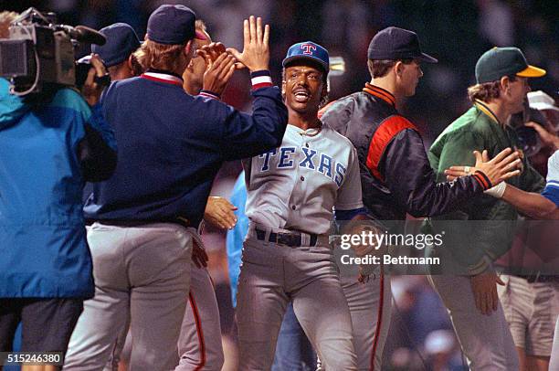 Chicago: Texas Rangers' Julio Franco is congratulated after A. L. 2-0 win over the N.L. In All Star game 7/10. Franco's 7th inning double scored the...