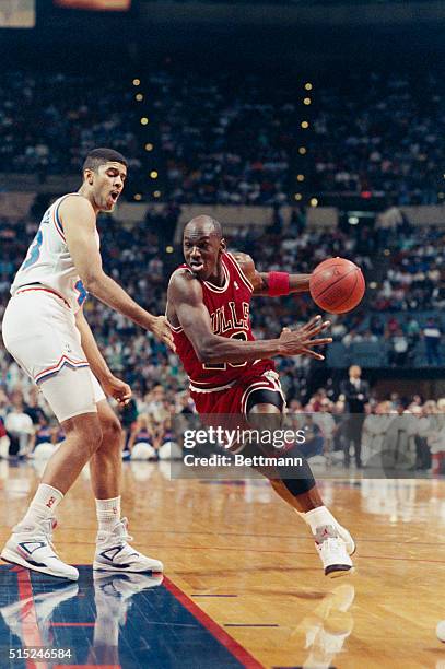 Richfield, Ohio. Michael Jordan of Chicago, working his way around Brad Daugherty, heads torward the basket in first half action at the Coliseum,...