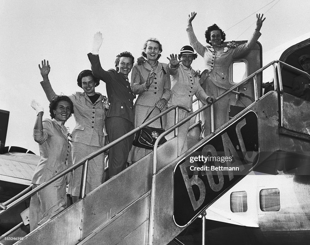 Women Golfers Waving from Airplane Staircase