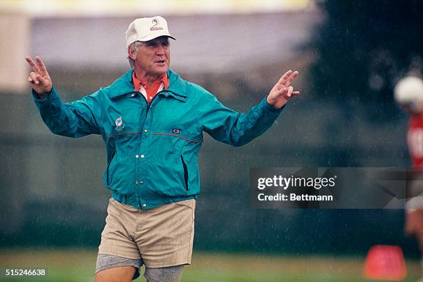 Miami: Don Shula conducts the first day of practice for the Miami Dolphins inspite of rain 7/17. The 1989 season marks Shula's nineteenth year as...