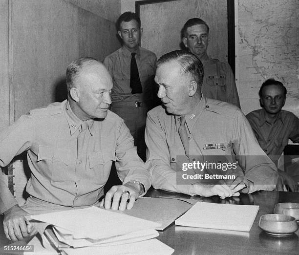 Gen. Dwight D. Eisenhower, left, 34th President of the United States and Commander in Chief of the Allied Forces in North Africa, converses with Gen....