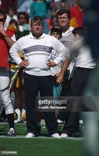 Washington: Dallas Cowboys head coach Jimmy Johnson holds his hands on his hips as he watches from the sidelines late in the second quarter. The...