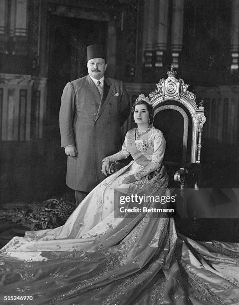 This is the first posed picture of King Farouk of Egypt and his new bride, 17-year-old Queen Narriman, in the throne room at Abdin Palace in Cairo....