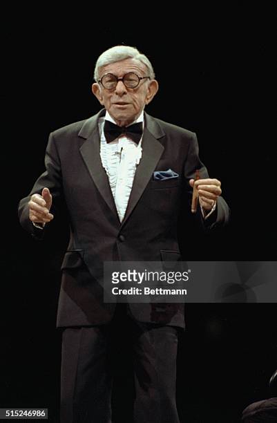 Comedians Bob Hope and George Burns performing together at Madison Square Garden.