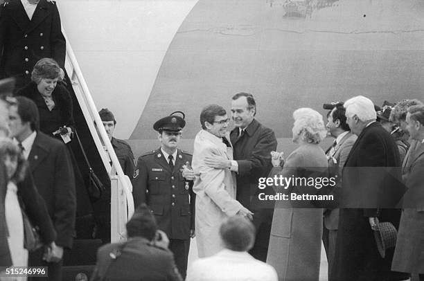 Vice President George Bush welcomes former hostage Bruce Liangen as he and the other former hostages arrived at nearby Andrews Air Force Base,...
