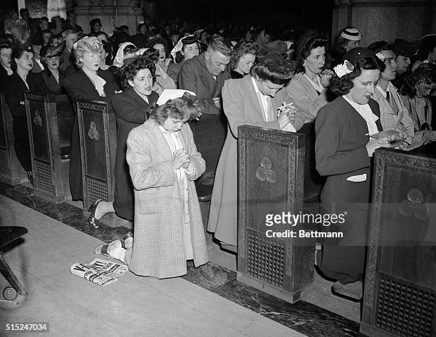 St. Thomas church-5th Ave. And 53 St people kneel in prayer on VE-Day.