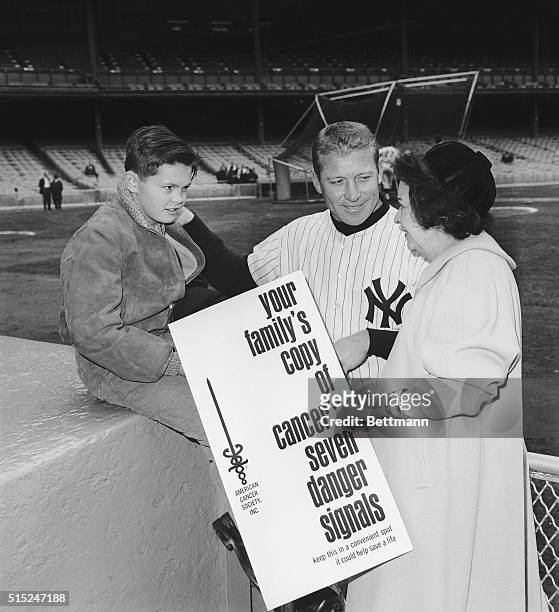 New York: Photo shows Mrs. Claire Ruth widow of Babe Ruth baseball immortal is shown with Tom Meloon age ten a grandson of Mrs. Ruth and they are...