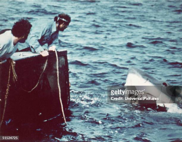 American actor Richard Dreyfuss and British author and actor Robert Shaw look off the stern of Quint's fishing boat the 'Orca' at the terrifying...
