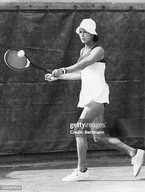 Doctor and tennis player Renee Richards makes backhand return as she practices, earlier this week, for her Sept. 1 match against reigning Wimbledon...