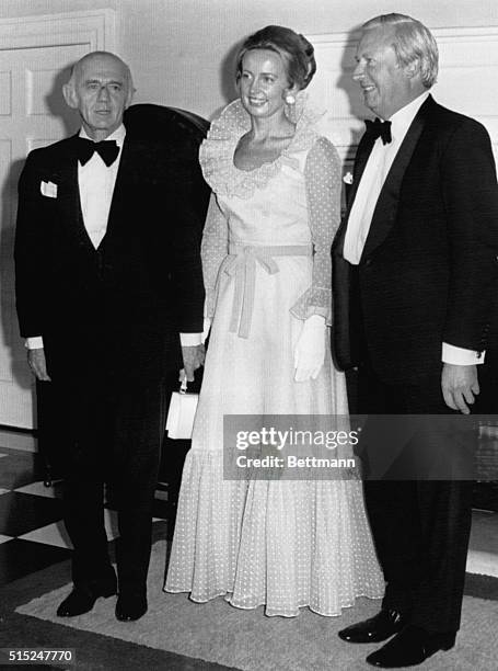 Wearing a considerably more modest costume than taht which she wore to a White House State Dinner November 2nd, Mrs. William McMahon is flanked by...