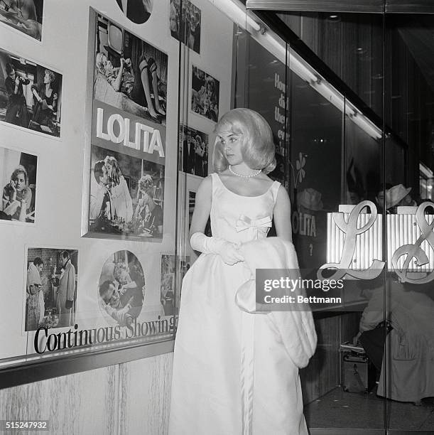 World premiere of the film "Lolita", Sue Lyon, the teenage Los Angeles girl who plays the title role. Because she is under eighteen, Miss Lyon will...